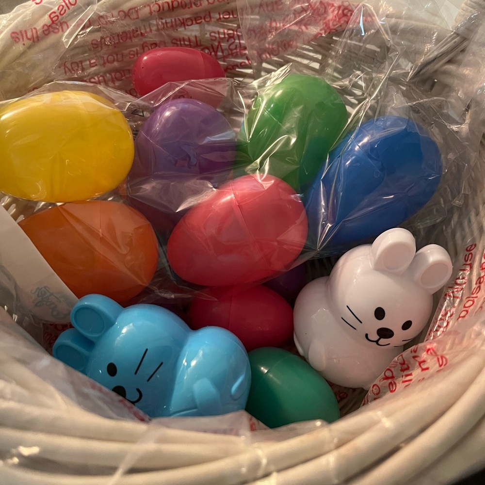 White Wicker Basket with Colorful plastic Easter eggs